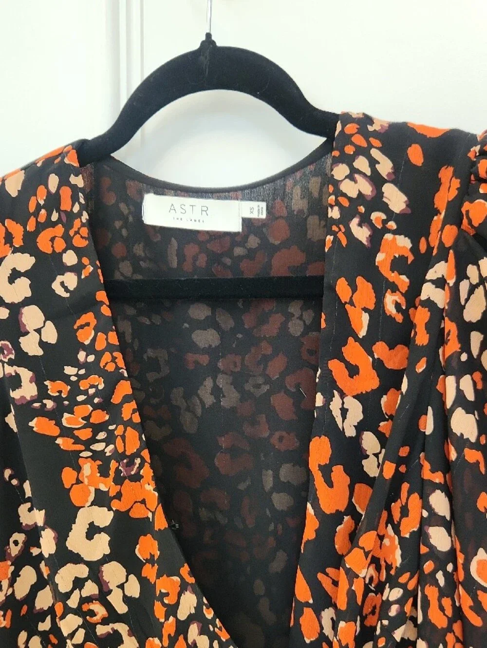 ASTR Black Wrap Blouse with Orange & Cream Leopard Print